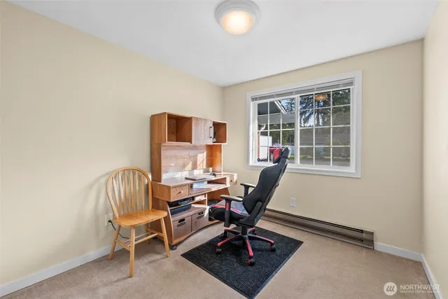 a work room with furniture and windows