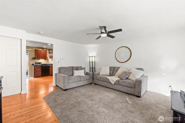 a living room with furniture white walls and white walls