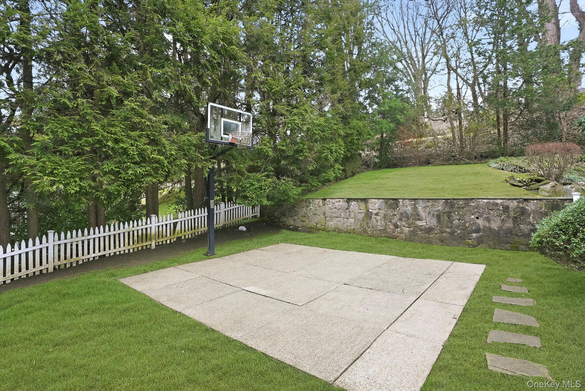 22 Taunton Road Scarsdale, NY 10583 - Photo 33 of 41 a view of a backyard with a garden