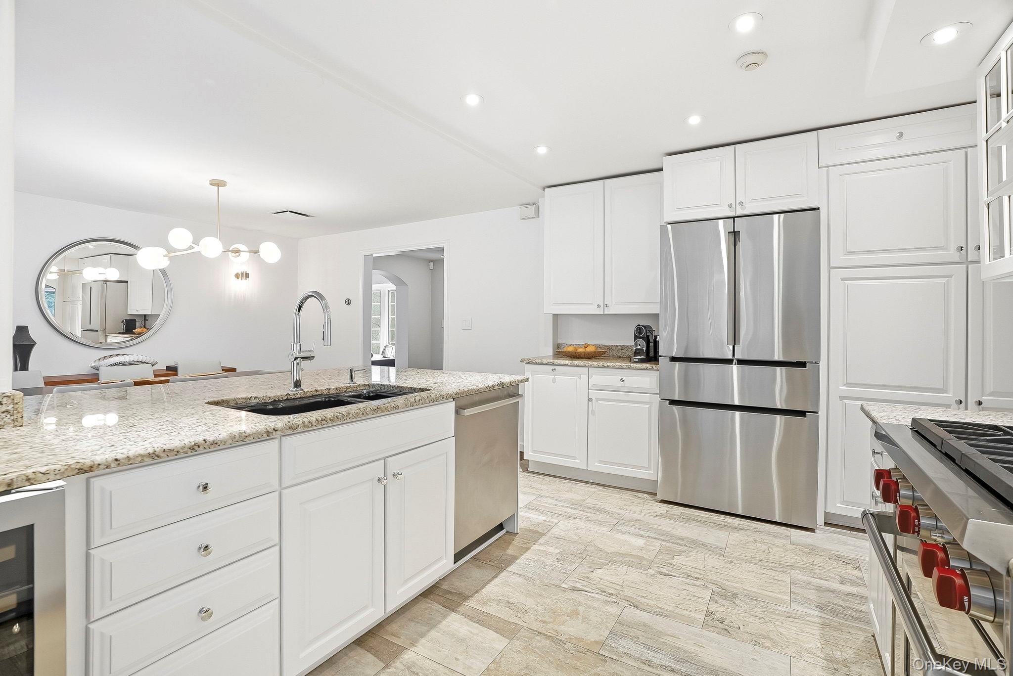 22 Taunton Road Scarsdale, NY 10583 - Photo 6 of 41 a kitchen with a sink refrigerator and cabinets