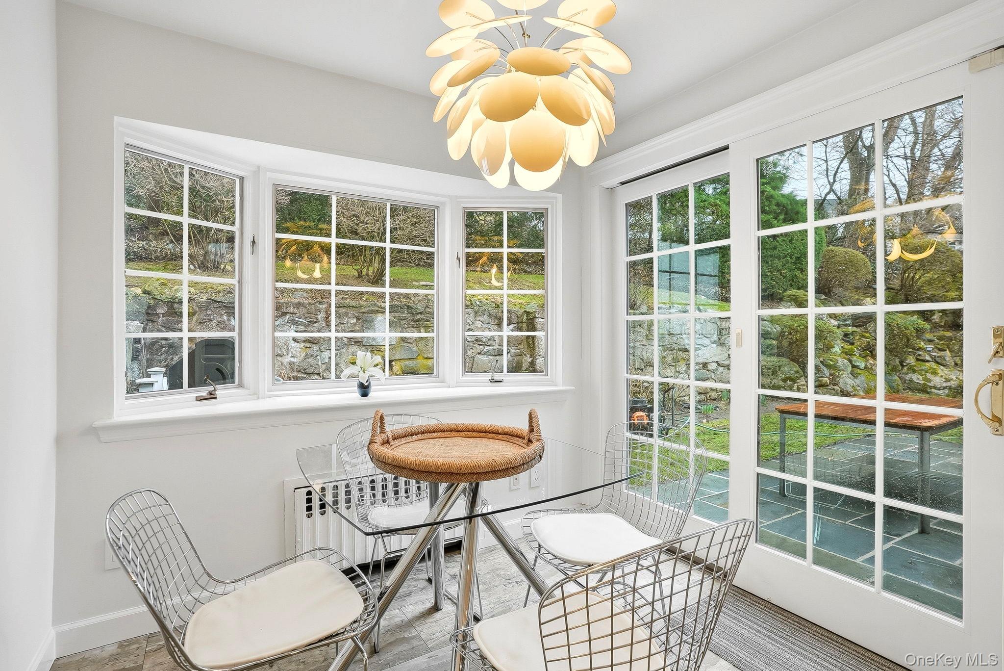 22 Taunton Road Scarsdale, NY 10583 - Photo 9 of 41 a view of a dining room with furniture and chandelier