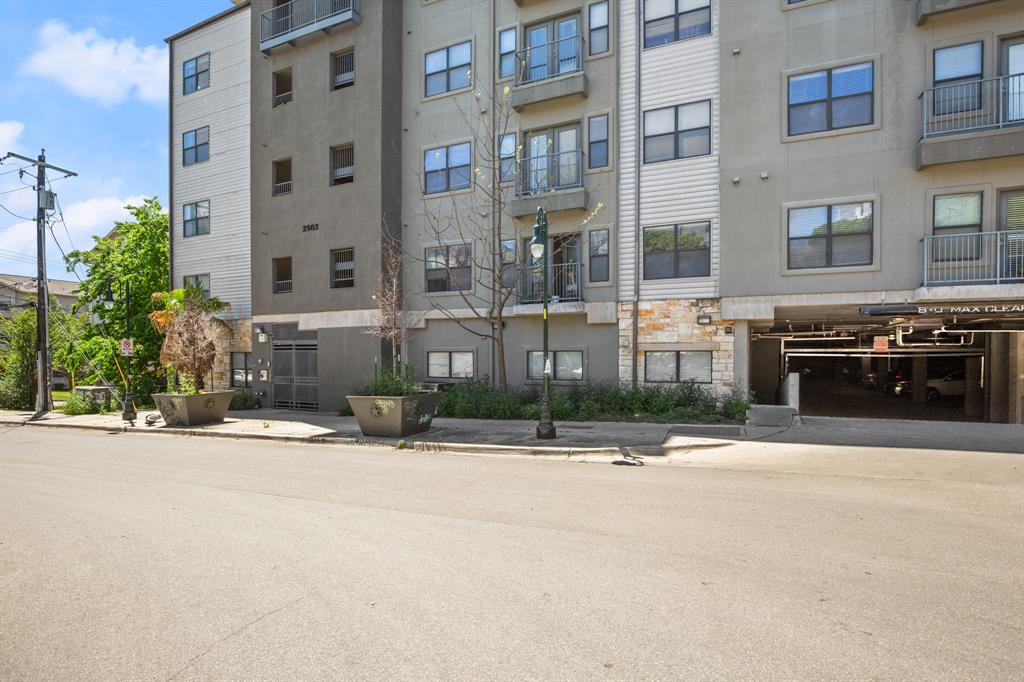 2502 Leon Street, Unit 218 Austin, TX 78705 - Photo 15 of 17 a front view of a building with cars parked