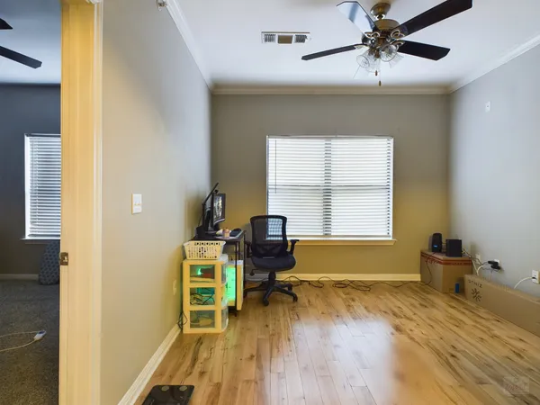 a bed room with a bed and a chair