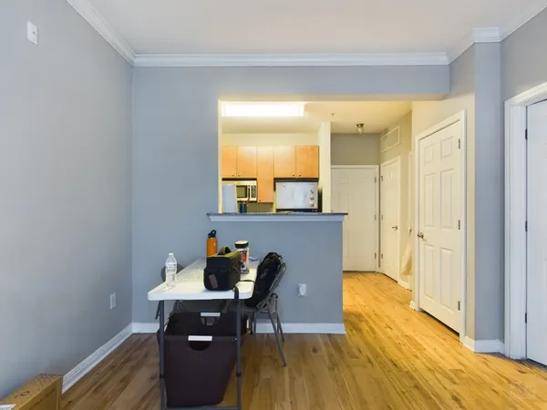 a view of a workspace with furniture and wooden floor