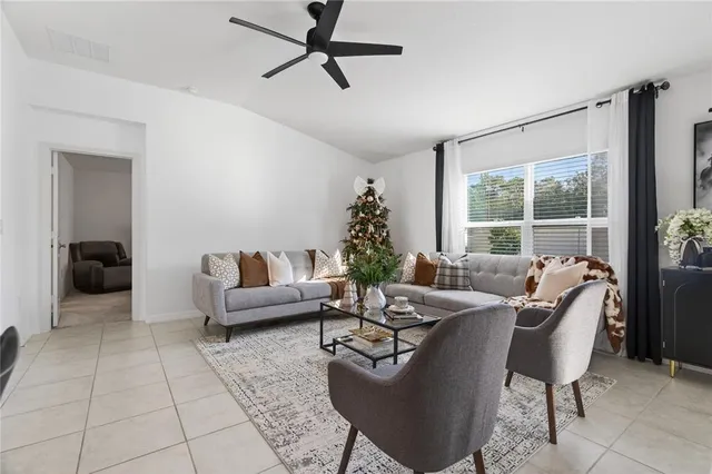 a living room with furniture and a window