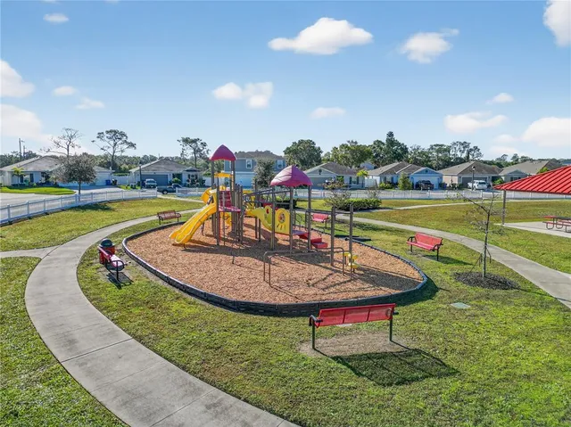 a view of a swimming pool with a yard