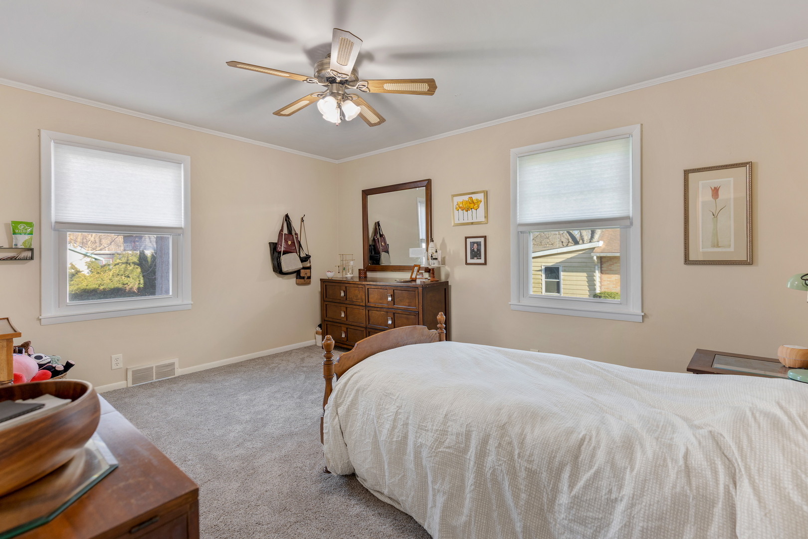 32 Jayne Street Algonquin, IL 60102 - Photo 17 of 22 a bedroom with a bed and a chandelier