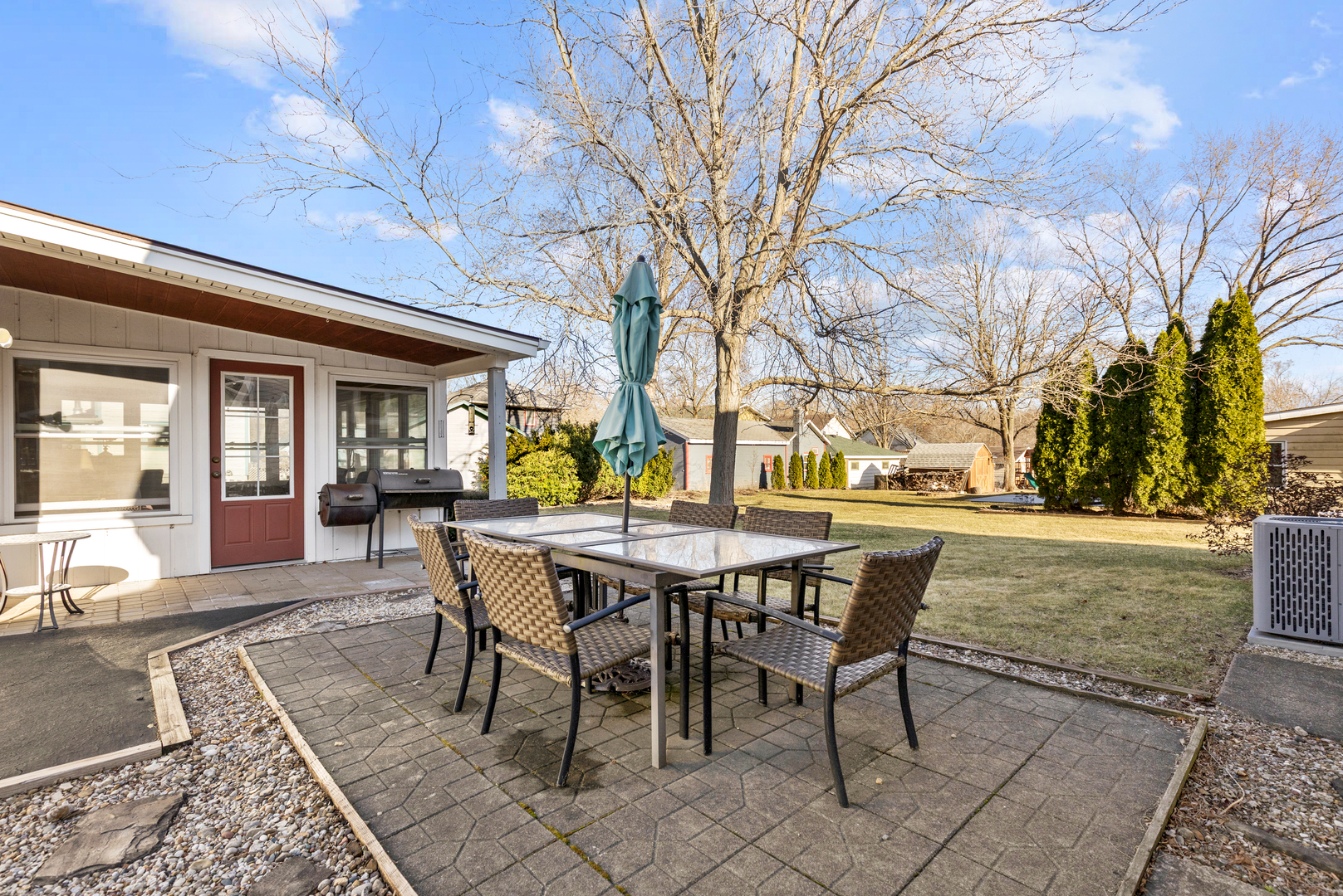 32 Jayne Street Algonquin, IL 60102 - Photo 18 of 22 a view of a patio with table and chairs and floor to ceiling window