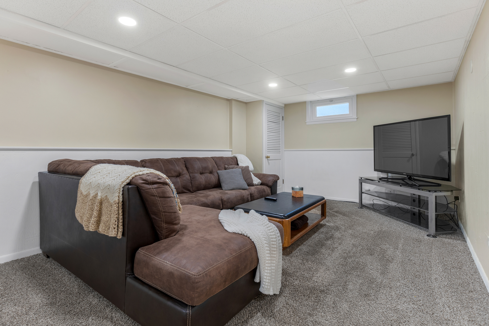 32 Jayne Street Algonquin, IL 60102 - Photo 10 of 22 a living room with furniture and a flat screen tv