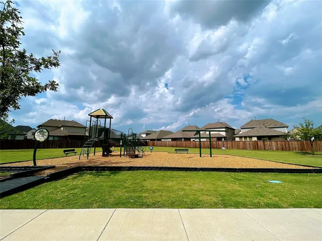 a view of a garden with sitting area