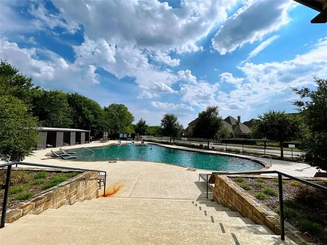 a view of a swimming pool with a lake view
