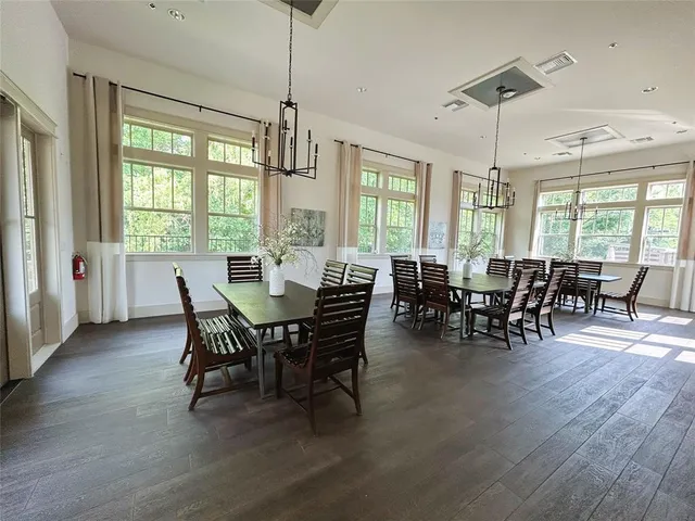a view of a dining room with furniture window and outside view
