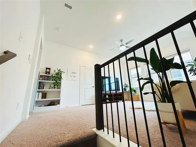 a view of staircase with rug