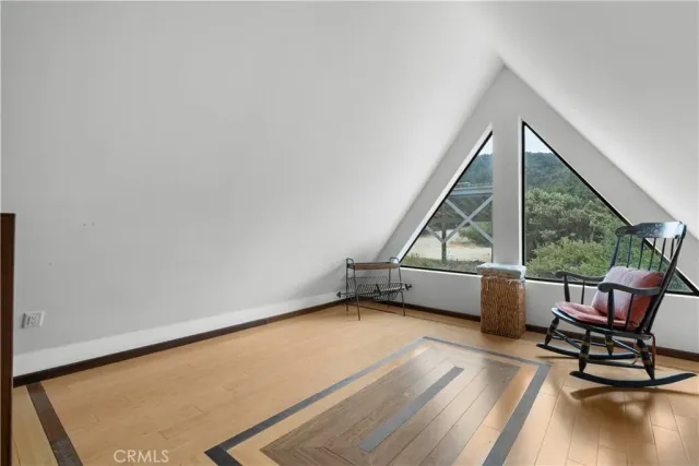 a view of a livingroom with wooden floor
