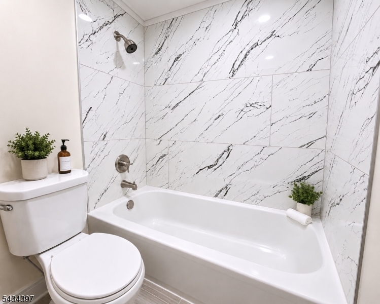 207 Old Chimney Ridge Road, Unit L Montague, NJ 07827 - Photo 12 of 14 a bathroom with a toilet and a bathtub