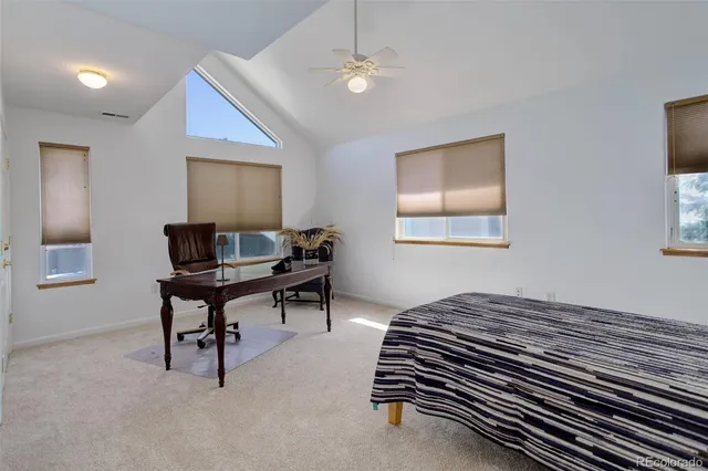 a bedroom with furniture and a window