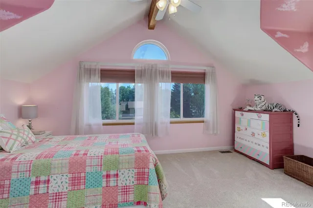 a bedroom with a bed dresser and a window