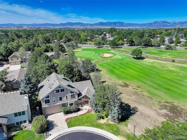 an aerial view of a house with outdoor space
