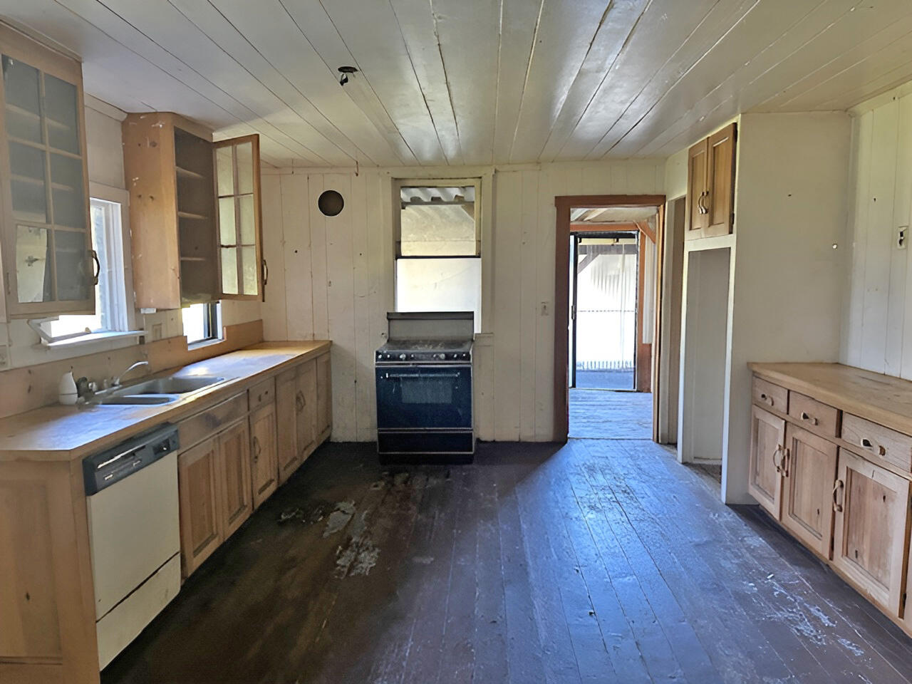 1489 Lower South Fork Road Hyampom, CA 96046 - Photo 12 of 22 a large kitchen with a lot of counter space and wooden floor