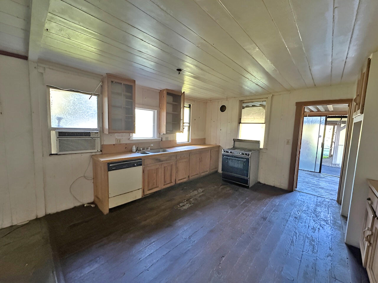 1489 Lower South Fork Road Hyampom, CA 96046 - Photo 13 of 22 a large kitchen with hard wood floors and stainless steel appliances