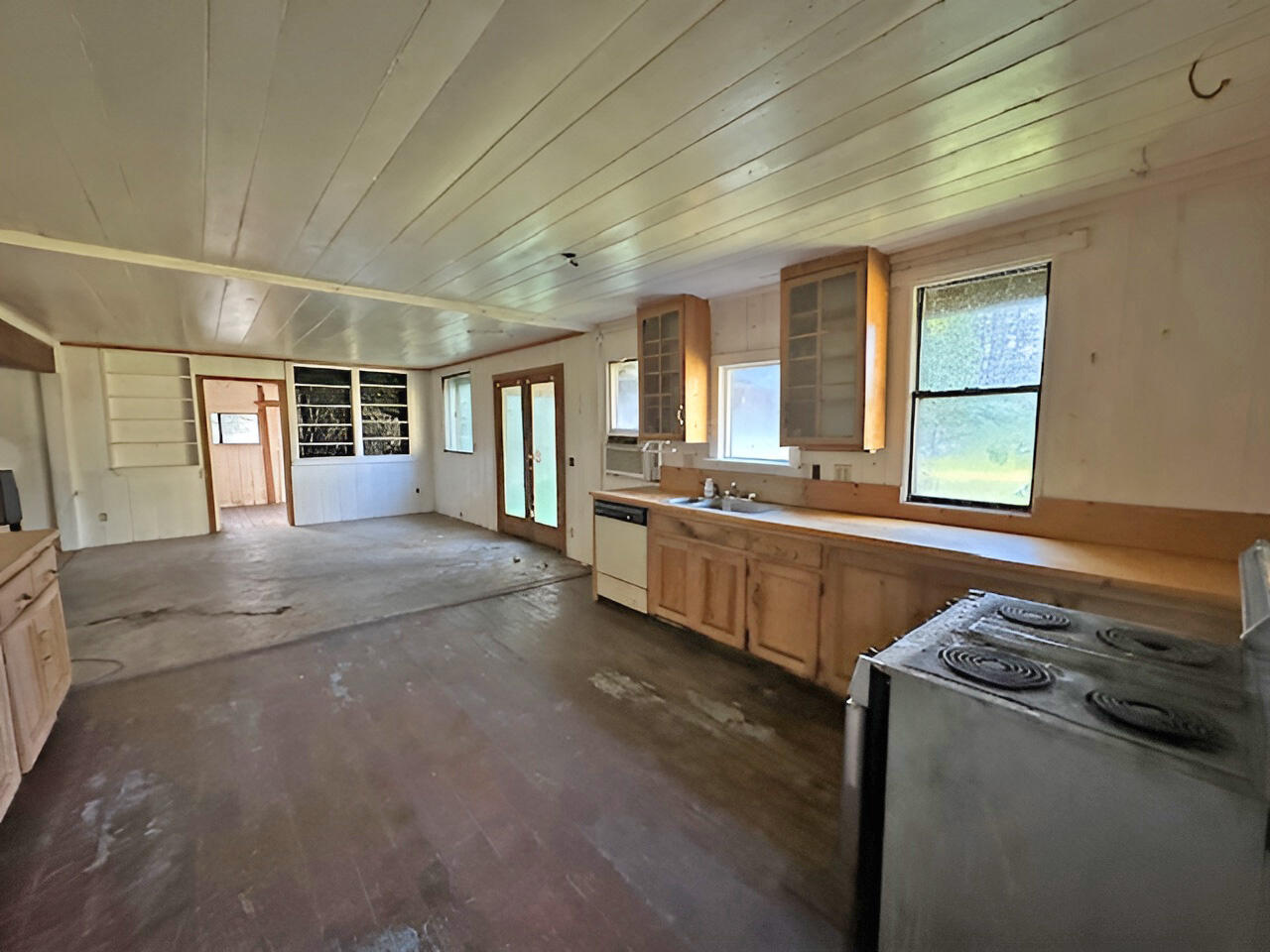 1489 Lower South Fork Road Hyampom, CA 96046 - Photo 15 of 22 a large white kitchen with sink and cabinets