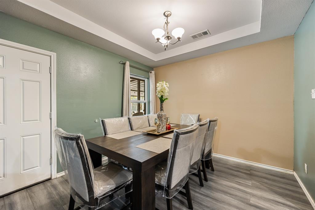 600 St Luke Street Terrell, TX 75160 - Photo 11 of 21 a view of a dining room with furniture and wooden floor