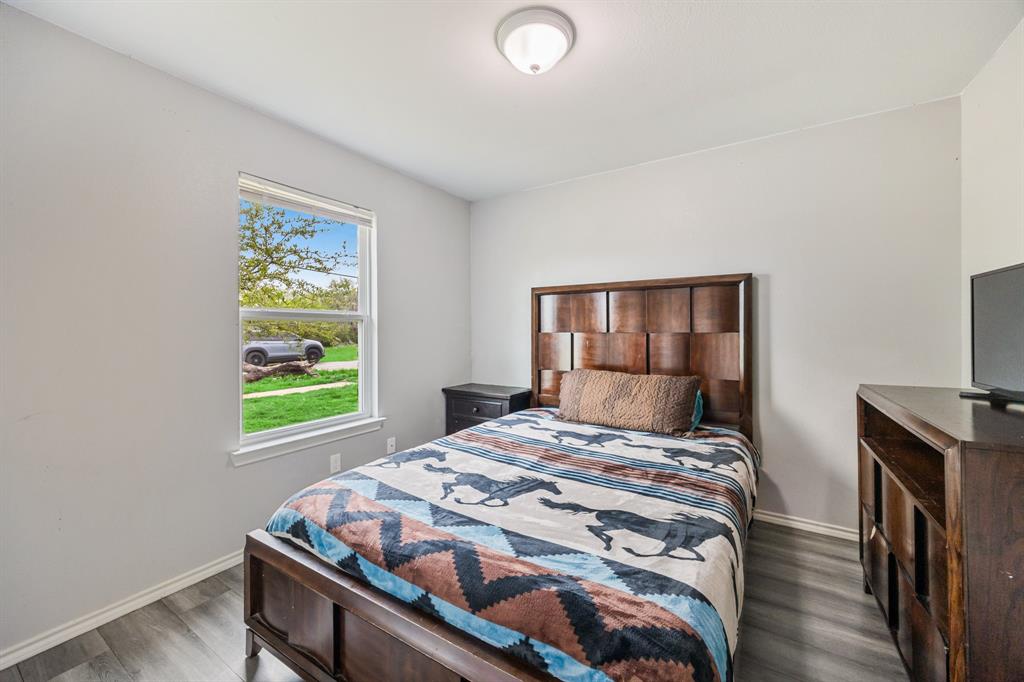 600 St Luke Street Terrell, TX 75160 - Photo 18 of 21 a bedroom with a bed and a window