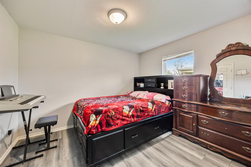 600 St Luke Street Terrell, TX 75160 - Photo 19 of 21 a bed room with a bed and a chair
