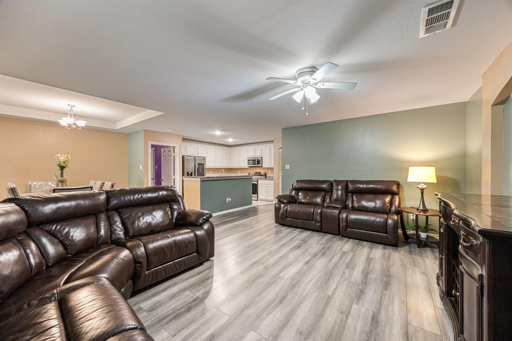 600 St Luke Street Terrell, TX 75160 - Photo 9 of 21 a living room with furniture and a wooden floor