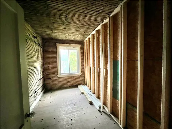 a view of a porch with wooden floor and stairs