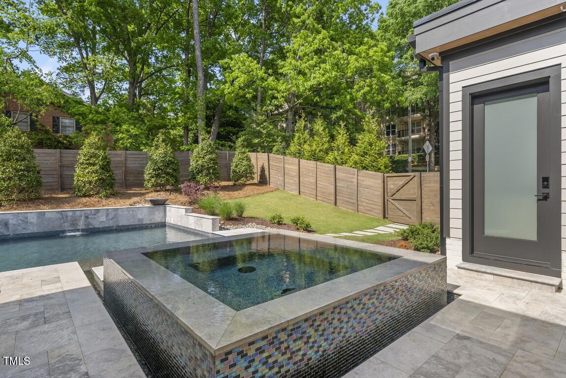 4139 Rockingham Drive Raleigh, NC 27609 - Photo 3 of 77 swimming pool view with a seating space