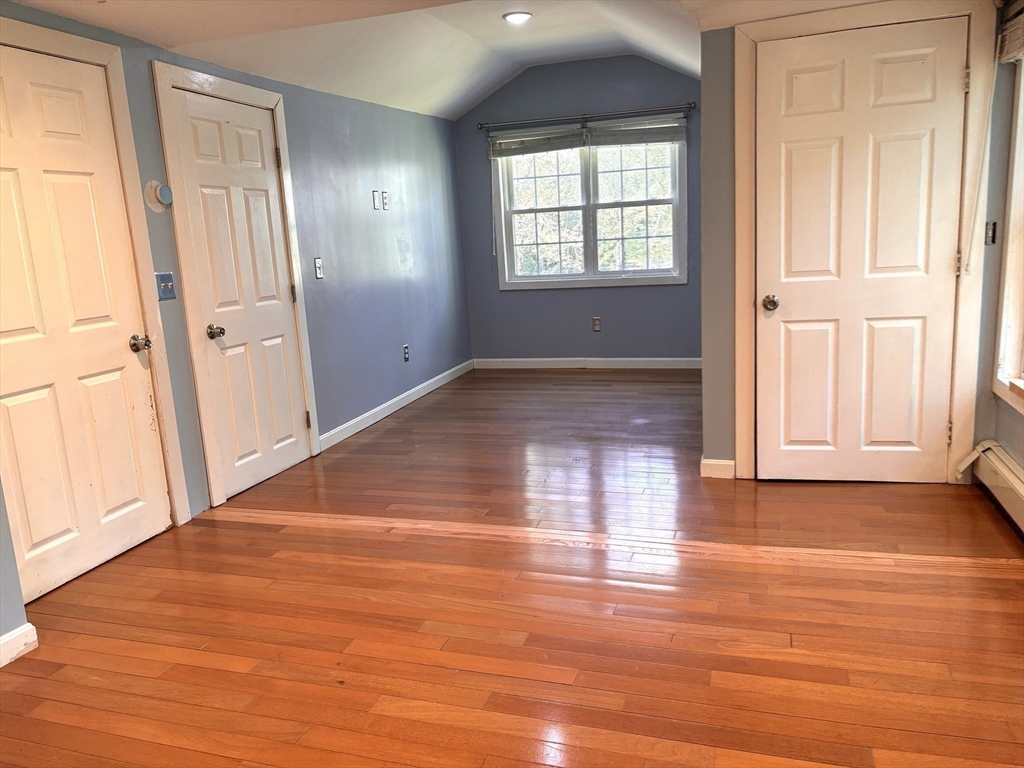 1694 Round Top Road Burrillville, RI 02830 - Photo 13 of 28 an empty room with wooden floor and windows