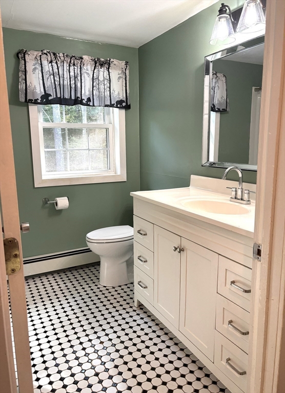 1694 Round Top Road Burrillville, RI 02830 - Photo 18 of 28 a bathroom with a sink a toilet and mirror