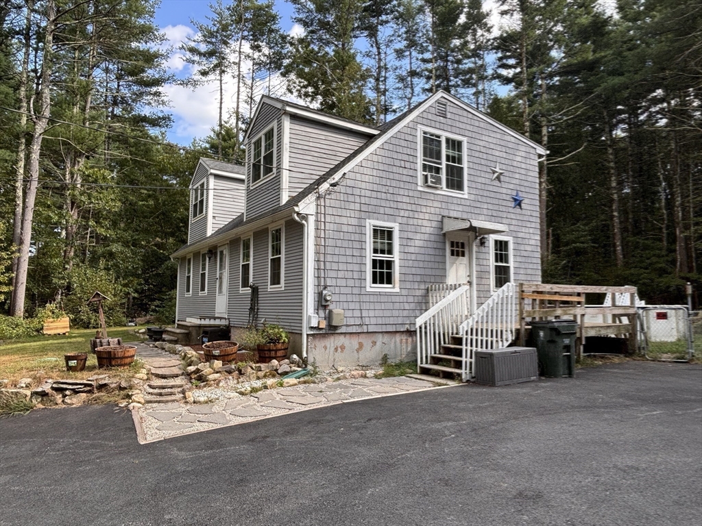 1694 Round Top Road Burrillville, RI 02830 - Photo 22 of 28 a view of a white house and a outdoor space