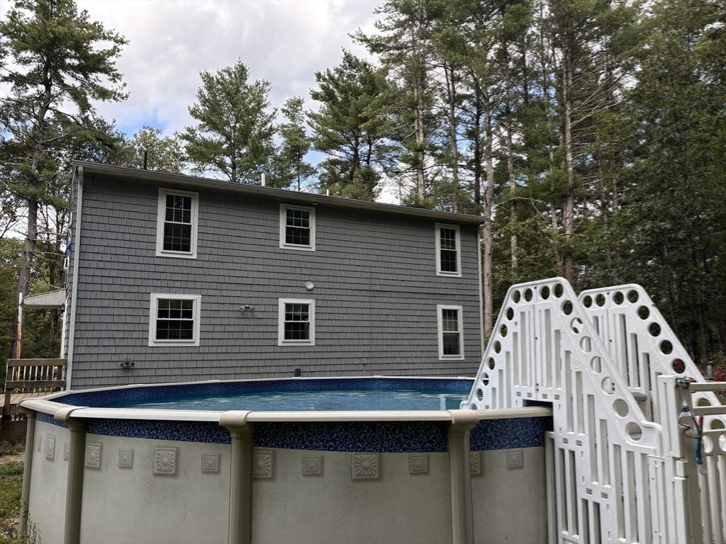 1694 Round Top Road Burrillville, RI 02830 - Photo 24 of 28 a side view of a house with a yard
