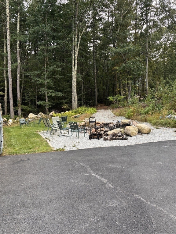 1694 Round Top Road Burrillville, RI 02830 - Photo 26 of 28 a view of backyard with swimming pool and outdoor seating