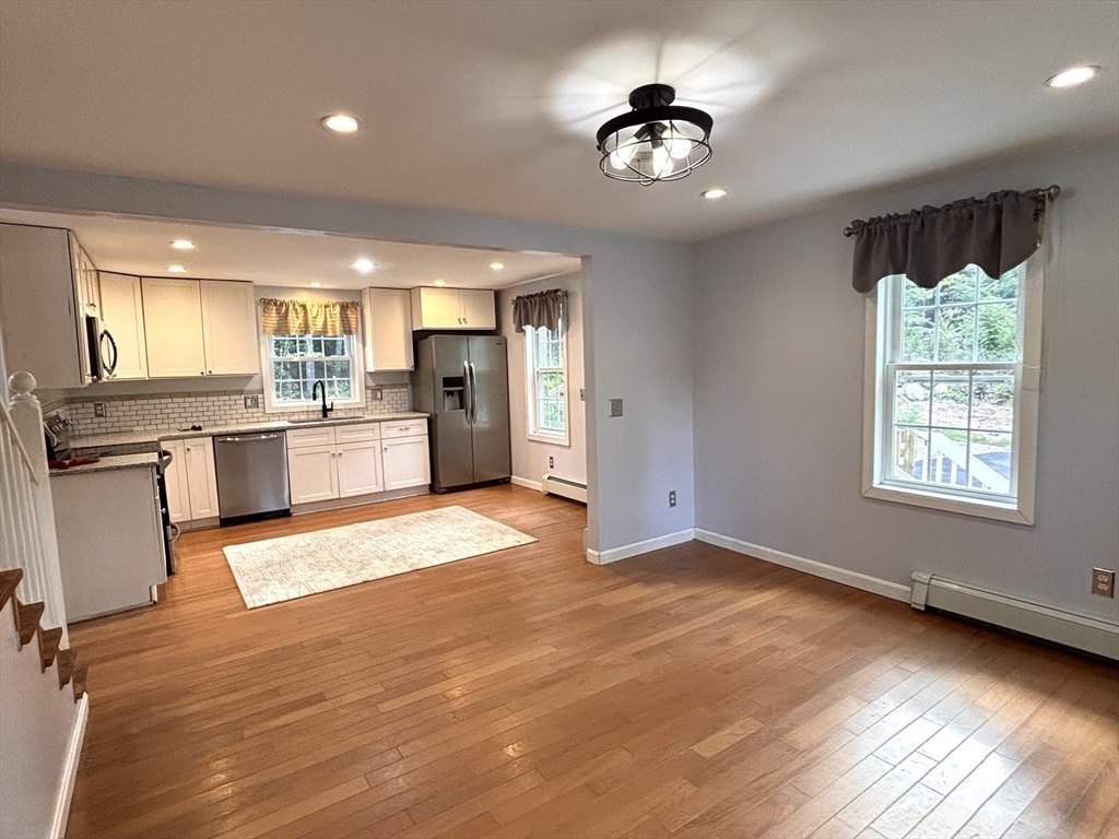 1694 Round Top Road Burrillville, RI 02830 - Photo 4 of 28 a view of a kitchen with a sink a refrigerator and window