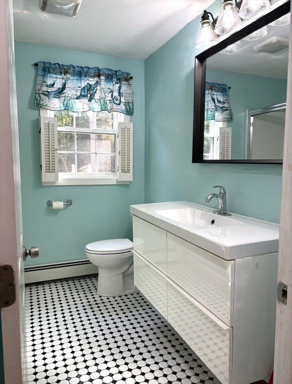 1694 Round Top Road Burrillville, RI 02830 - Photo 10 of 28 a bathroom with a sink and a mirror