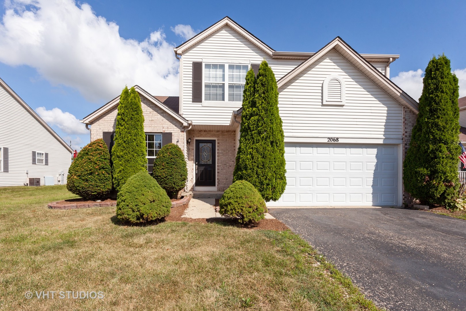 2068 Sutcliffe Drive Romeoville, IL 60446 - Photo 1 of 10 a view of a house with a yard and plants