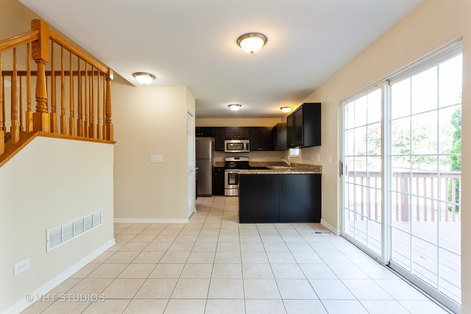 2068 Sutcliffe Drive Romeoville, IL 60446 - Photo 3 of 10 a large kitchen with stainless steel appliances granite countertop a refrigerator and a stove top oven