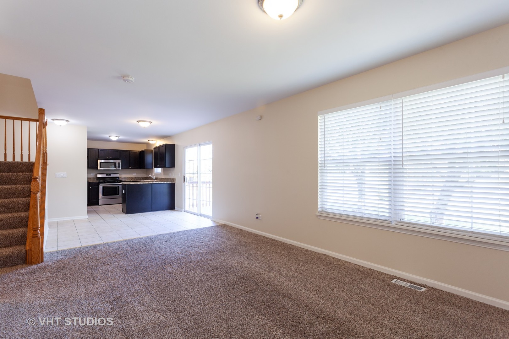 2068 Sutcliffe Drive Romeoville, IL 60446 - Photo 5 of 10 a view of kitchen with kitchen island sink and refrigerator
