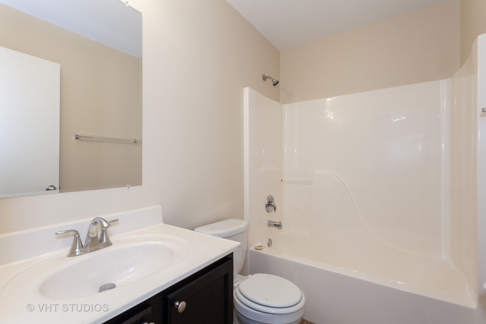 2068 Sutcliffe Drive Romeoville, IL 60446 - Photo 7 of 10 a bathroom with a sink a toilet and shower