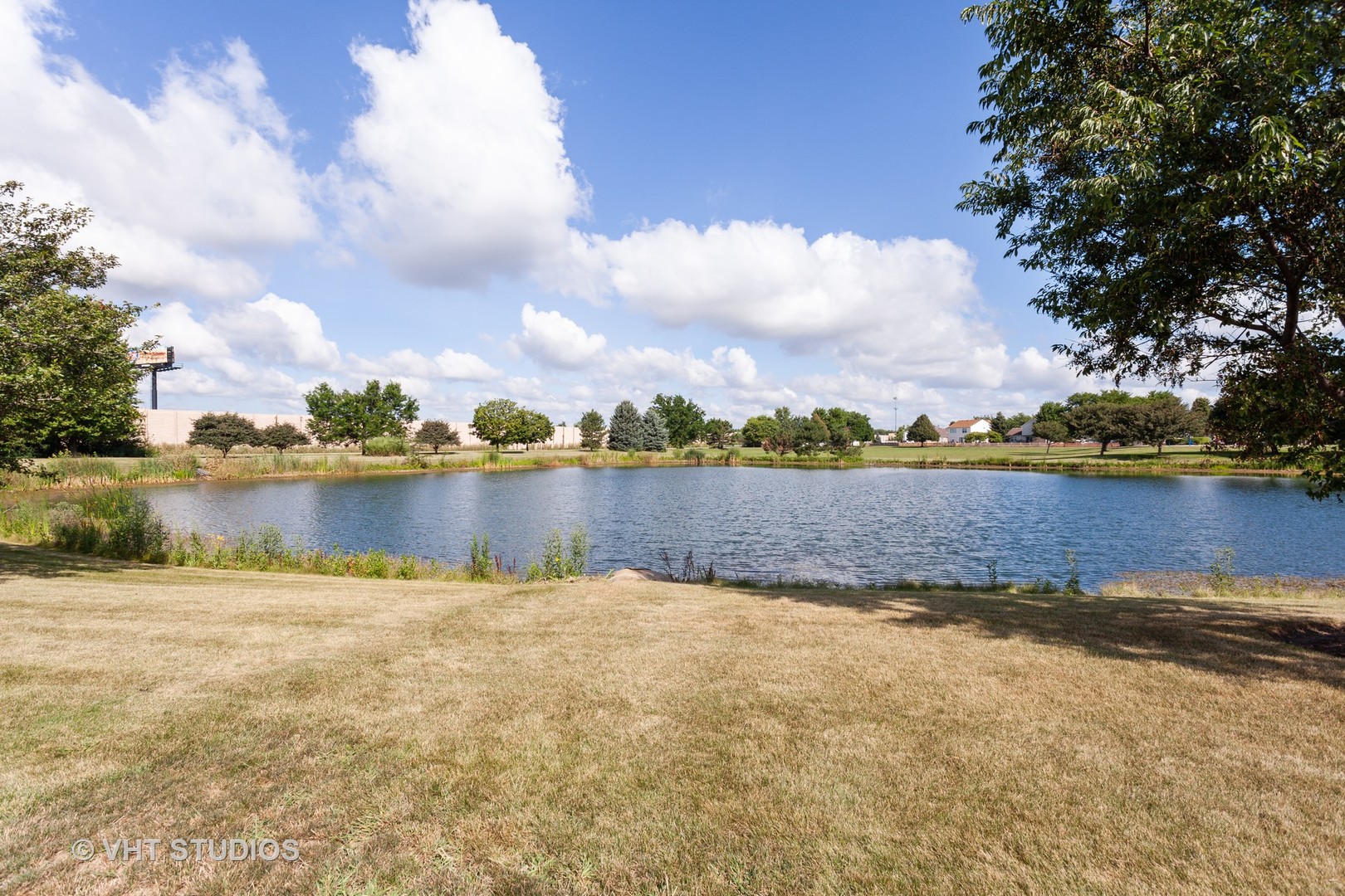 2068 Sutcliffe Drive Romeoville, IL 60446 - Photo 10 of 10 a view of a lake with houses in the back