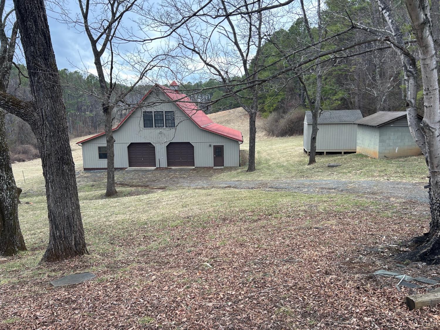 4775 Coffee Road Forest, VA 24551 - Photo 3 of 5 a house with a tree in front of it