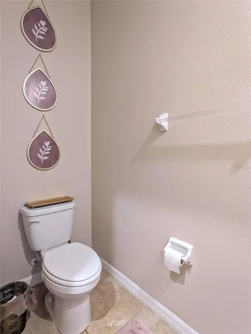 a bathroom with a toilet and a sink