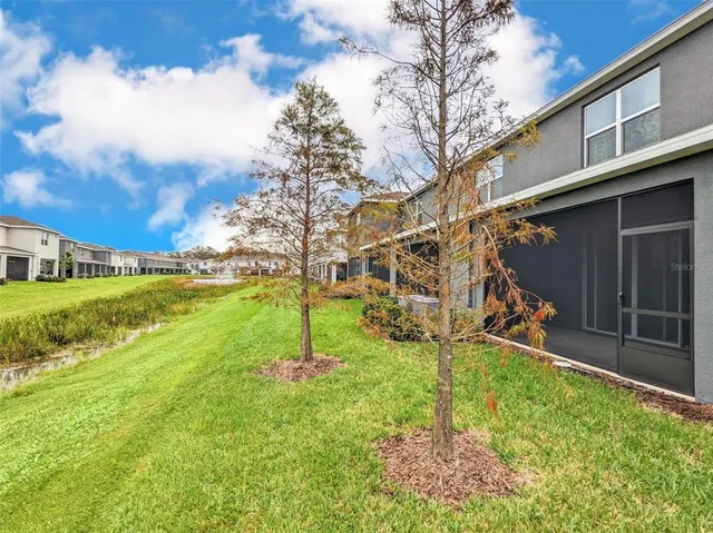 a backyard of a house with lots of green space