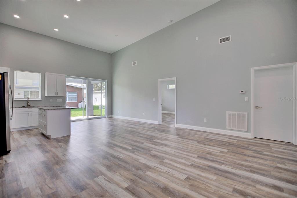 2545 Odessa Road Avon Park, FL 33825 - Photo 12 of 33 a view of a kitchen with wooden floor and a kitchen