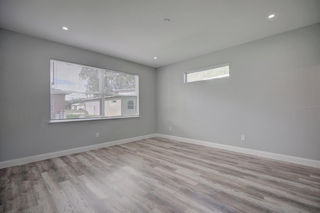 2545 Odessa Road Avon Park, FL 33825 - Photo 20 of 33 a view of empty room with wooden floor and fan
