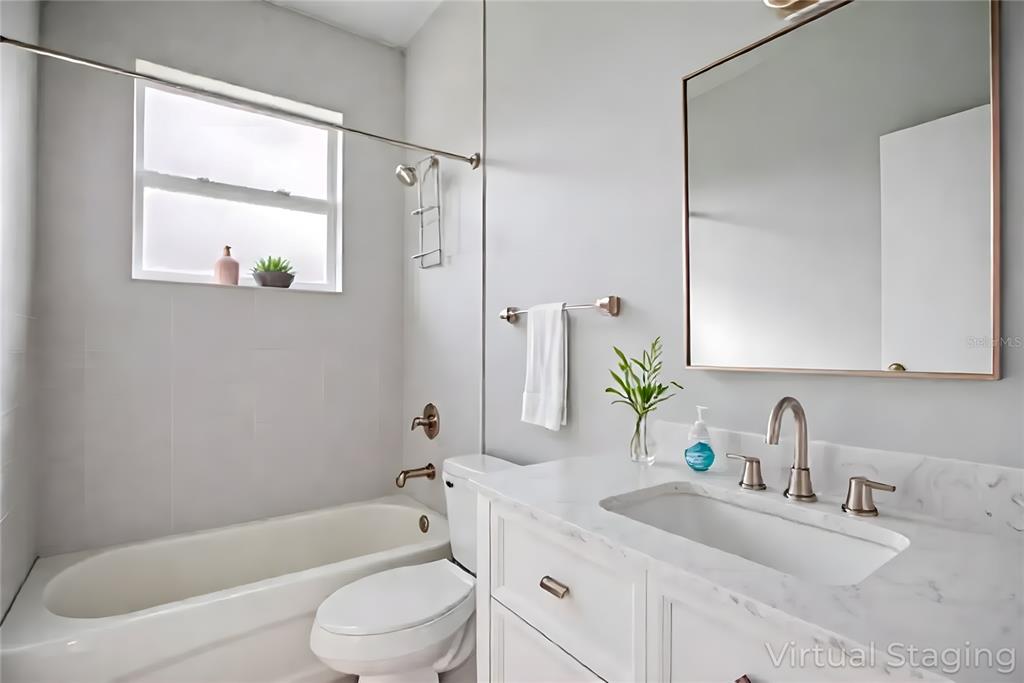 2545 Odessa Road Avon Park, FL 33825 - Photo 10 of 33 a bathroom with a sink toilet and shower