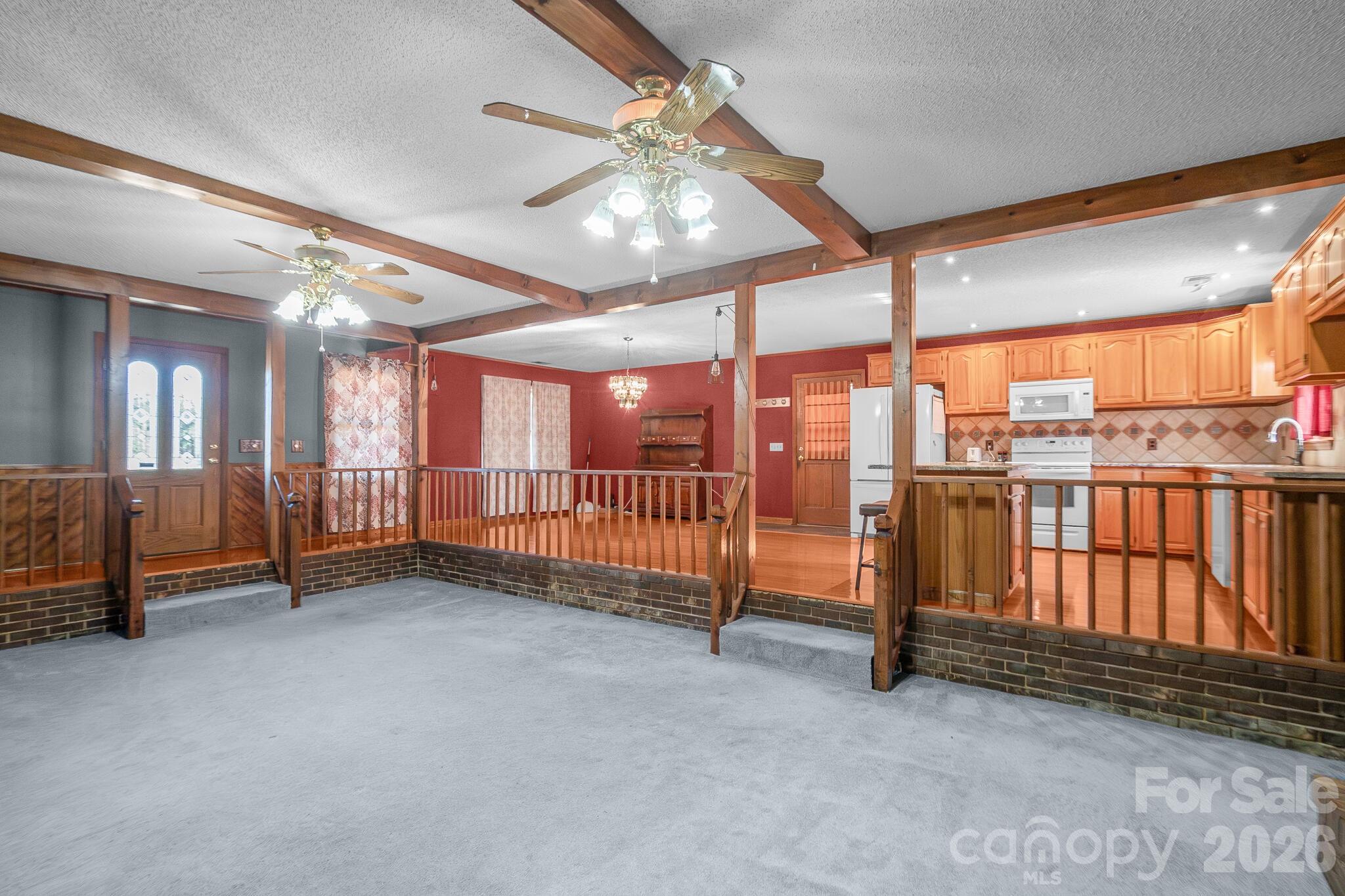 1295 Cattle Ridge Road Cheraw, SC 29520 - Photo 3 of 21 a view of an empty room with a balcony